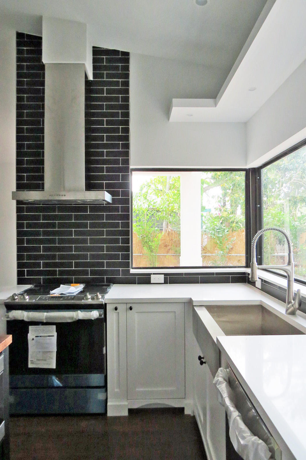 7 Cindy Place Key Largo, FL 33037 - Photo 16 of 31 a kitchen with granite countertop a stove sink and window