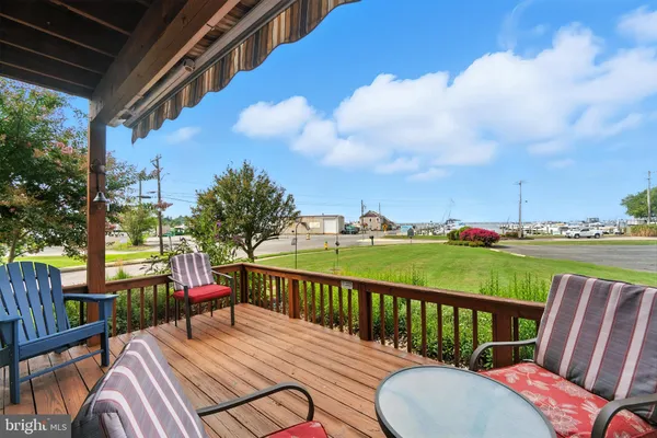 a view of a deck with two chair and a table