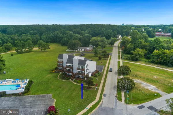 an aerial view of a house with a garden