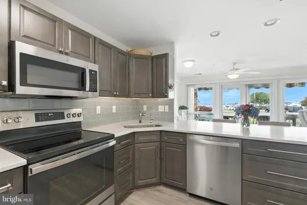 a kitchen with a refrigerator stove and microwave