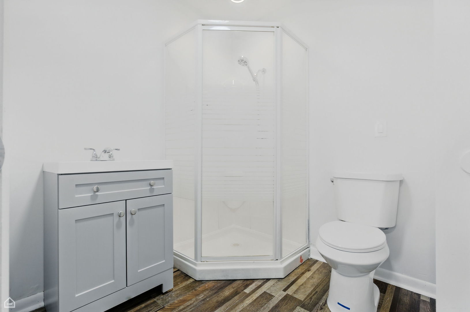 5301 State Road Burbank, IL 60459 - Photo 14 of 18 a bathroom with a toilet and a sink