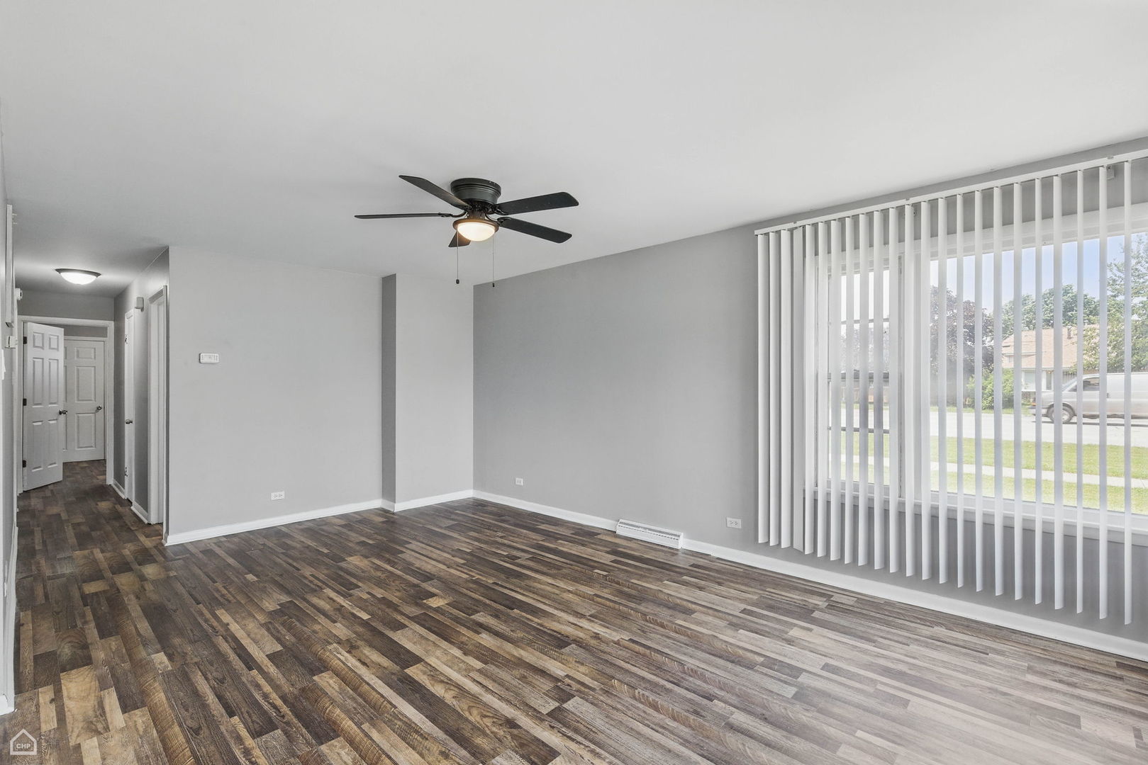 5301 State Road Burbank, IL 60459 - Photo 3 of 18 a view of a livingroom with a ceiling fan and window