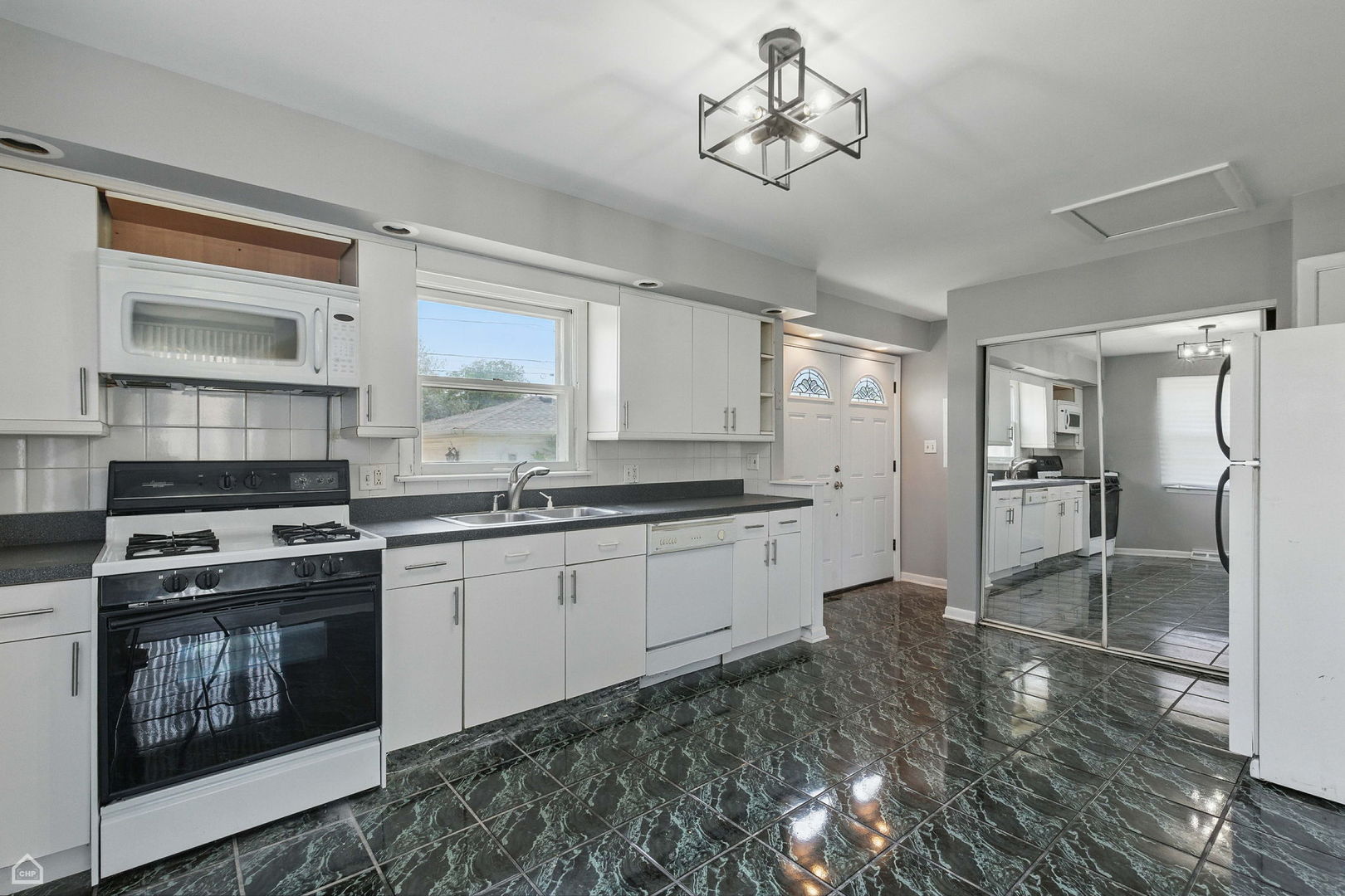 5301 State Road Burbank, IL 60459 - Photo 6 of 18 a kitchen with stainless steel appliances granite countertop a stove refrigerator and cabinets