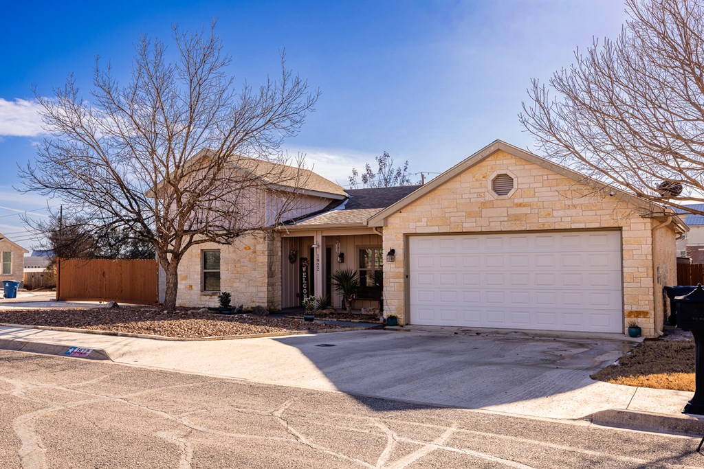 1922 Weston Loop Kerrville, TX 78028 - Photo 16 of 22 a front view of a house with a yard