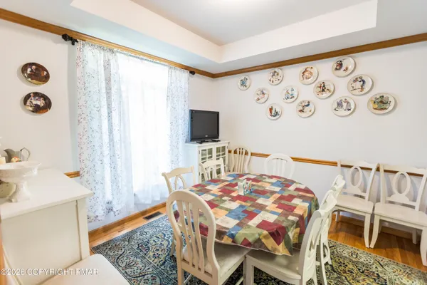 a view of a dining room with furniture