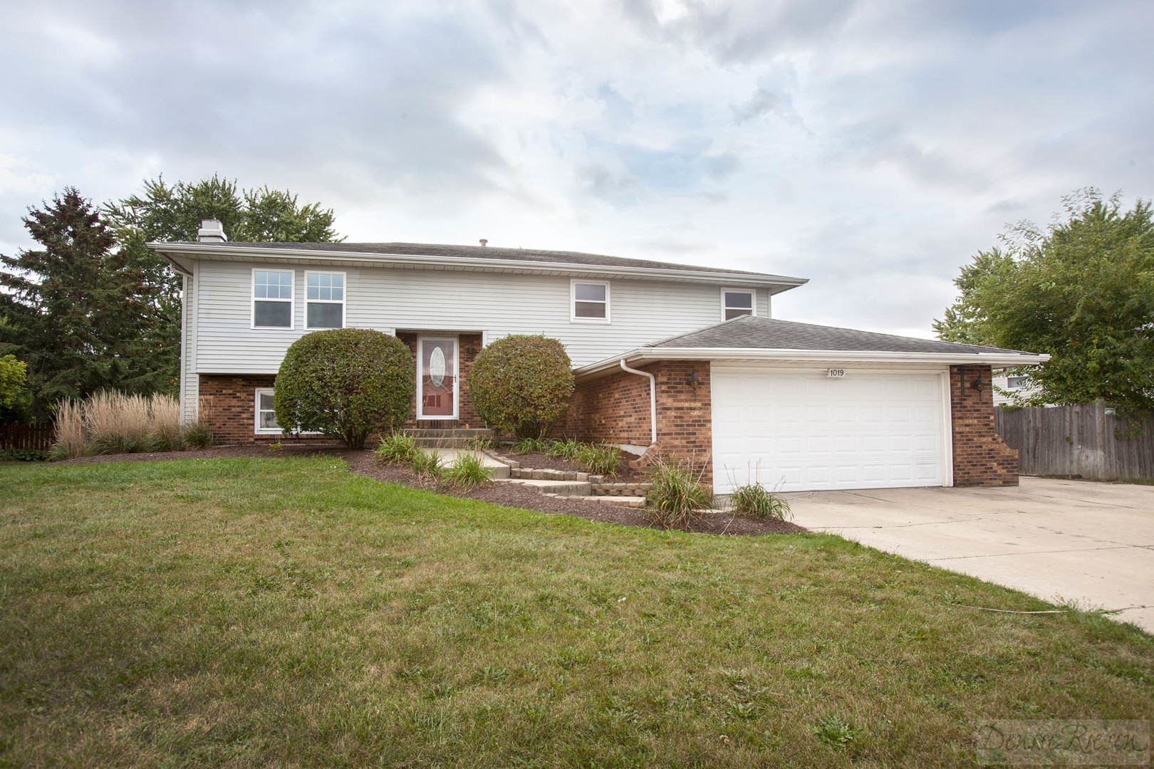 1019 Ridge Road Shorewood, IL 60404 - Photo 1 of 1 a view of a house with a yard and garage