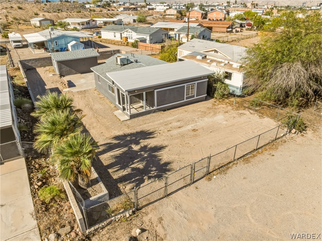 1628 Ramar Road Bullhead City, AZ 86442 - Photo 5 of 64 The property features a fenced yard with a casita and plenty of parking.