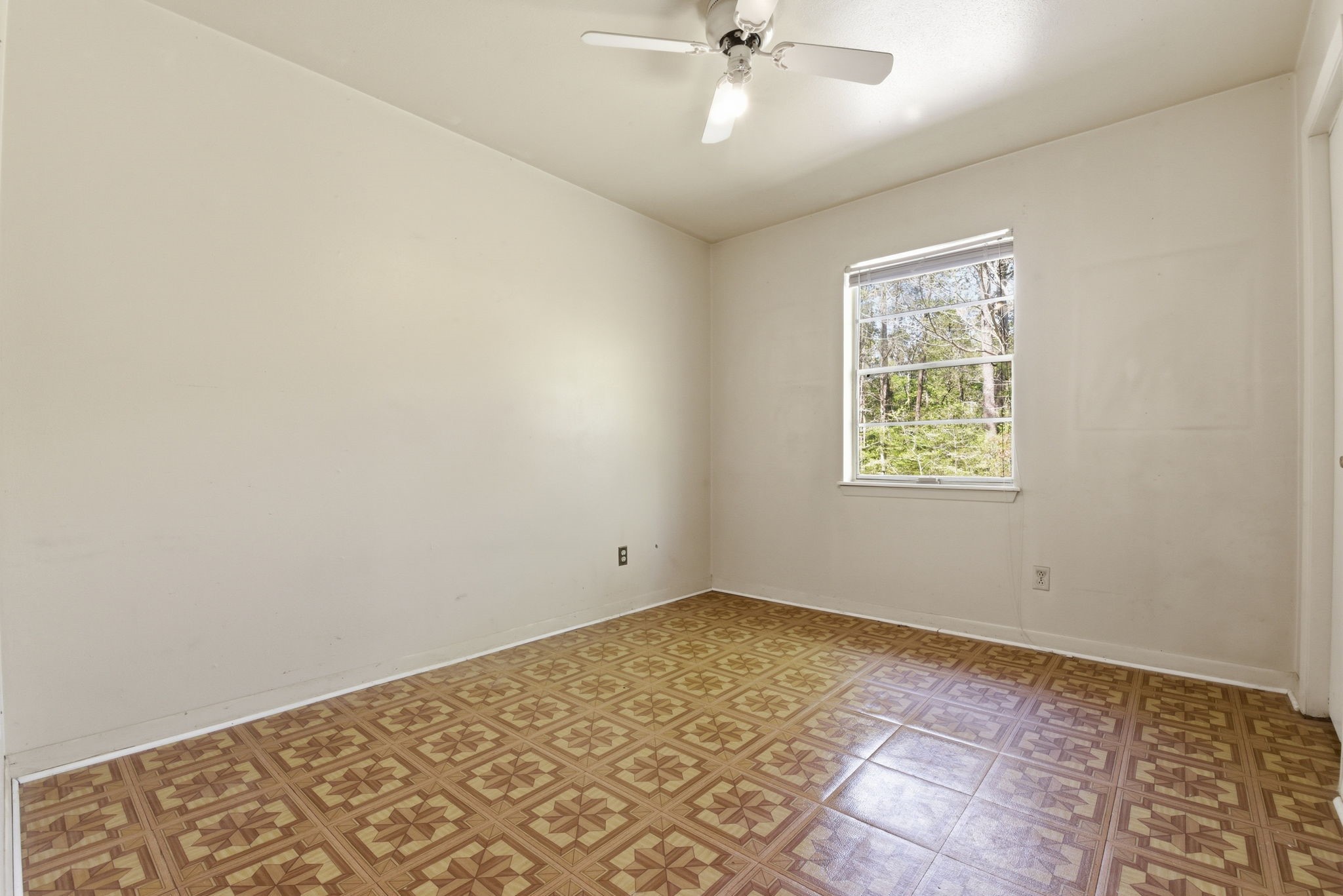 7555 Fm 1725 Road Coldspring, TX 77331 - Photo 15 of 31 an empty room with a window