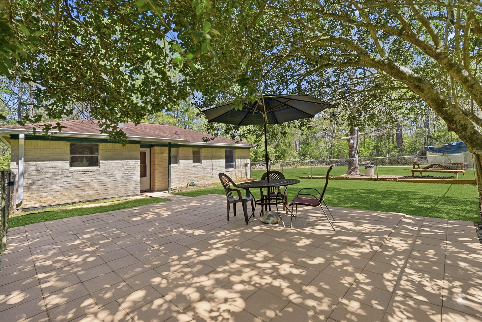 7555 Fm 1725 Road Coldspring, TX 77331 - Photo 2 of 31 a view of a house with a yard porch and sitting area