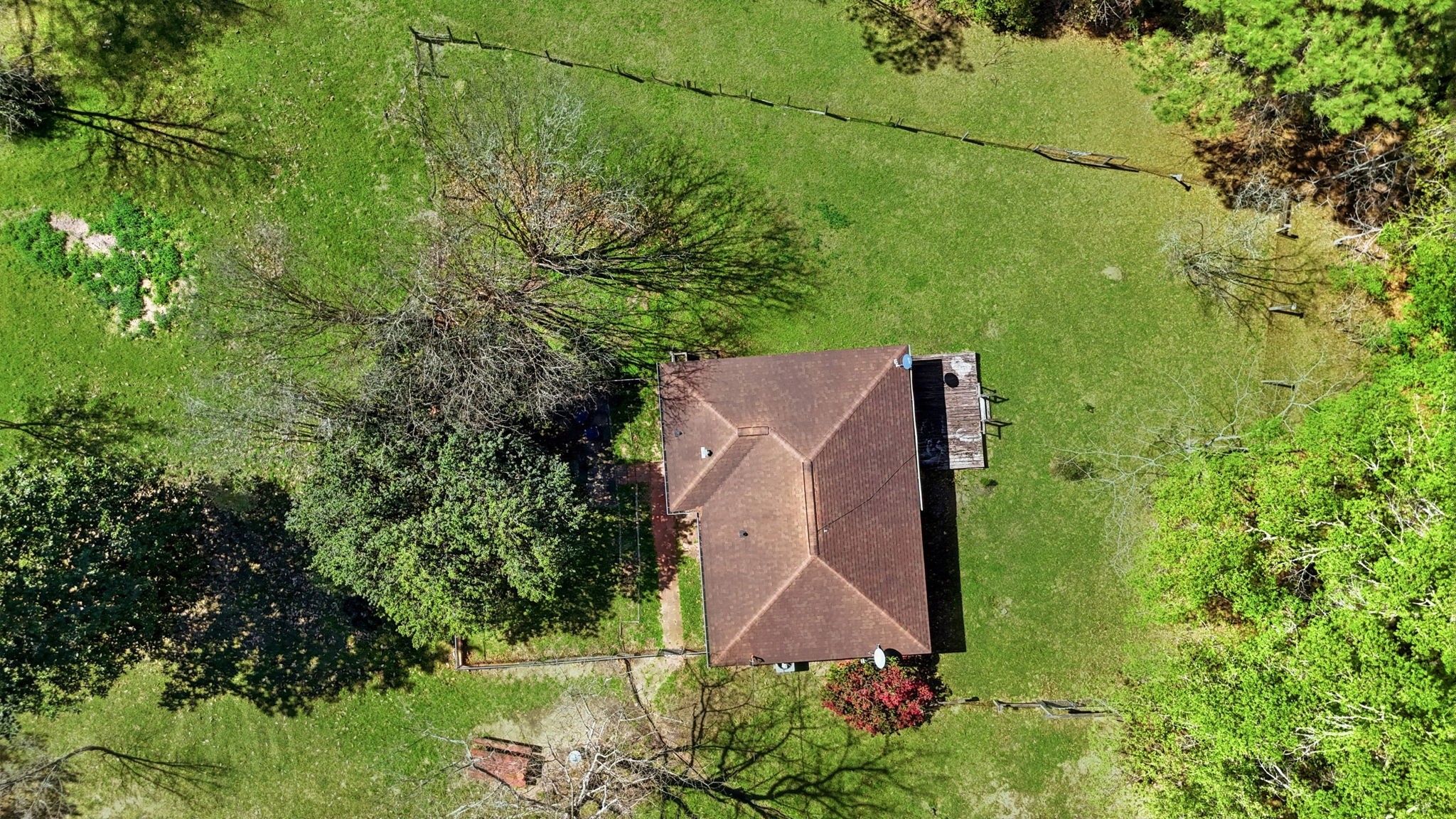 7555 Fm 1725 Road Coldspring, TX 77331 - Photo 27 of 31 an aerial view of a house with a yard