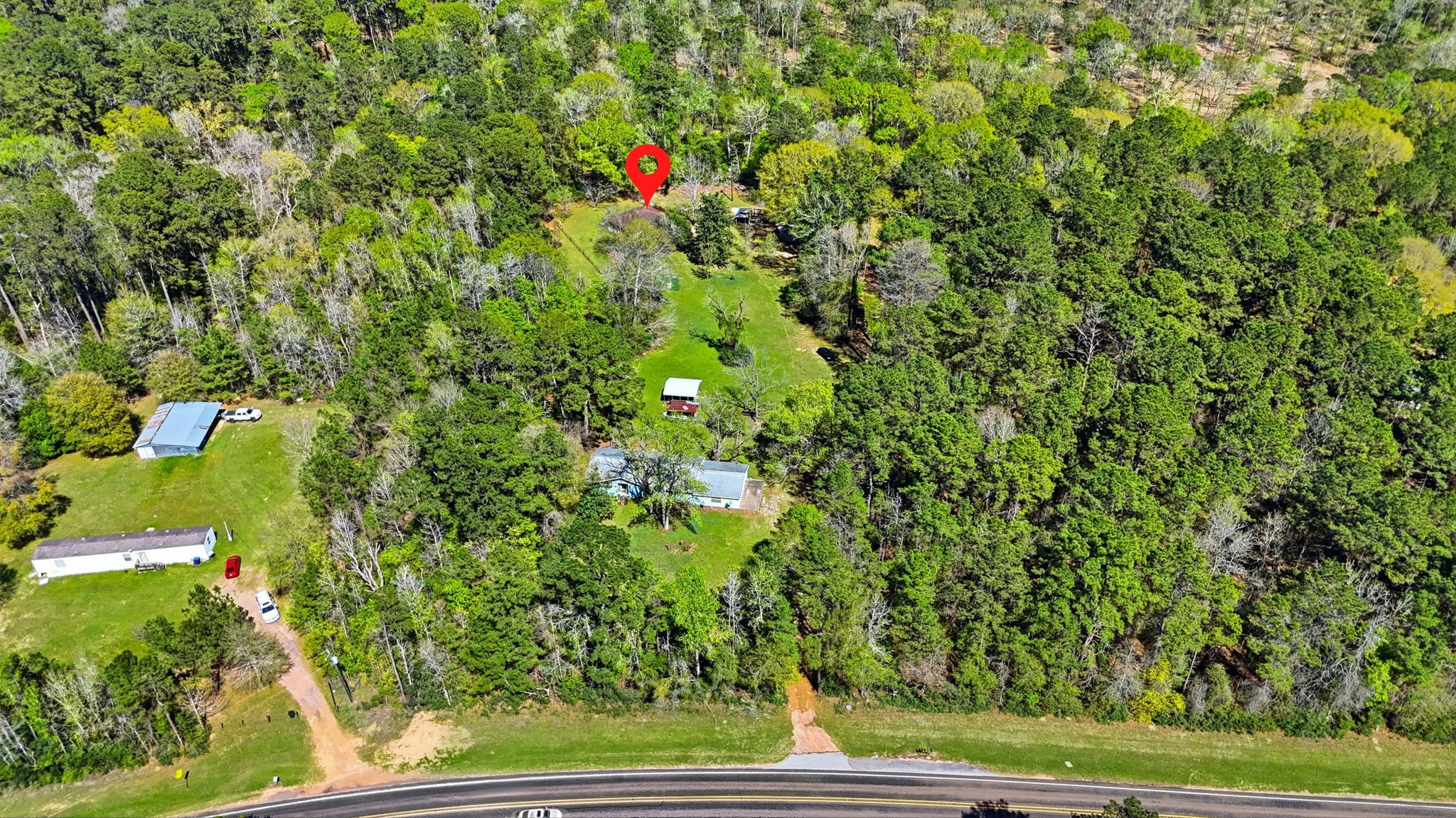 7555 Fm 1725 Road Coldspring, TX 77331 - Photo 28 of 31 a view of a yard with plants