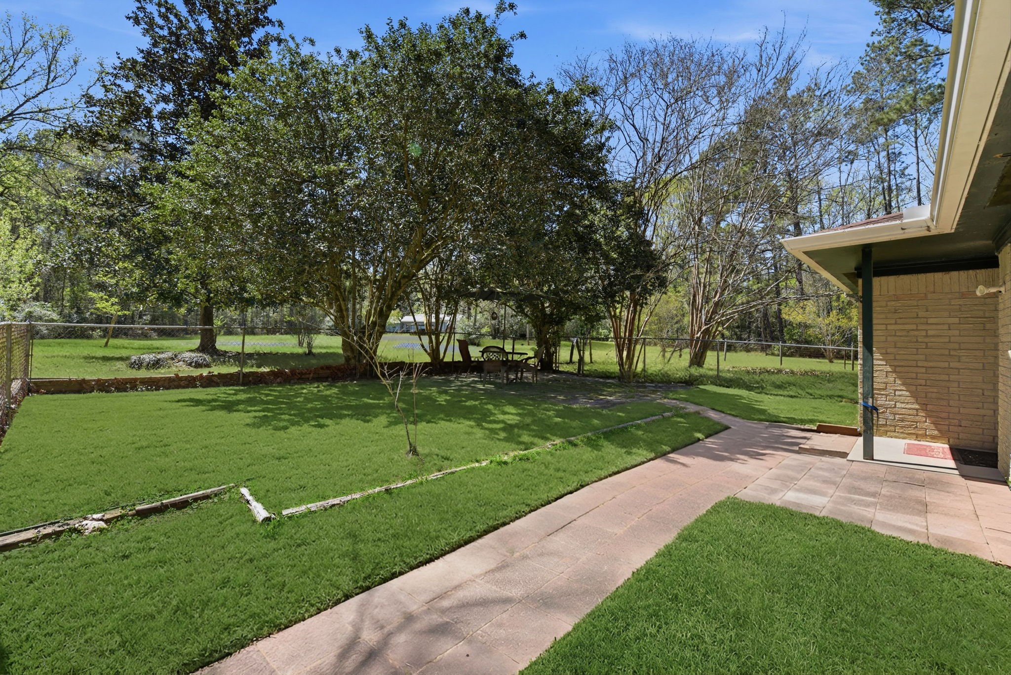 7555 Fm 1725 Road Coldspring, TX 77331 - Photo 4 of 31 a view of a park with large trees
