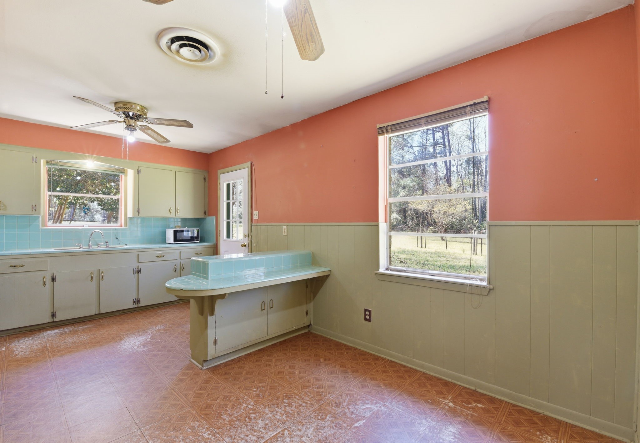 7555 Fm 1725 Road Coldspring, TX 77331 - Photo 5 of 31 a room with painting on the wall and a window