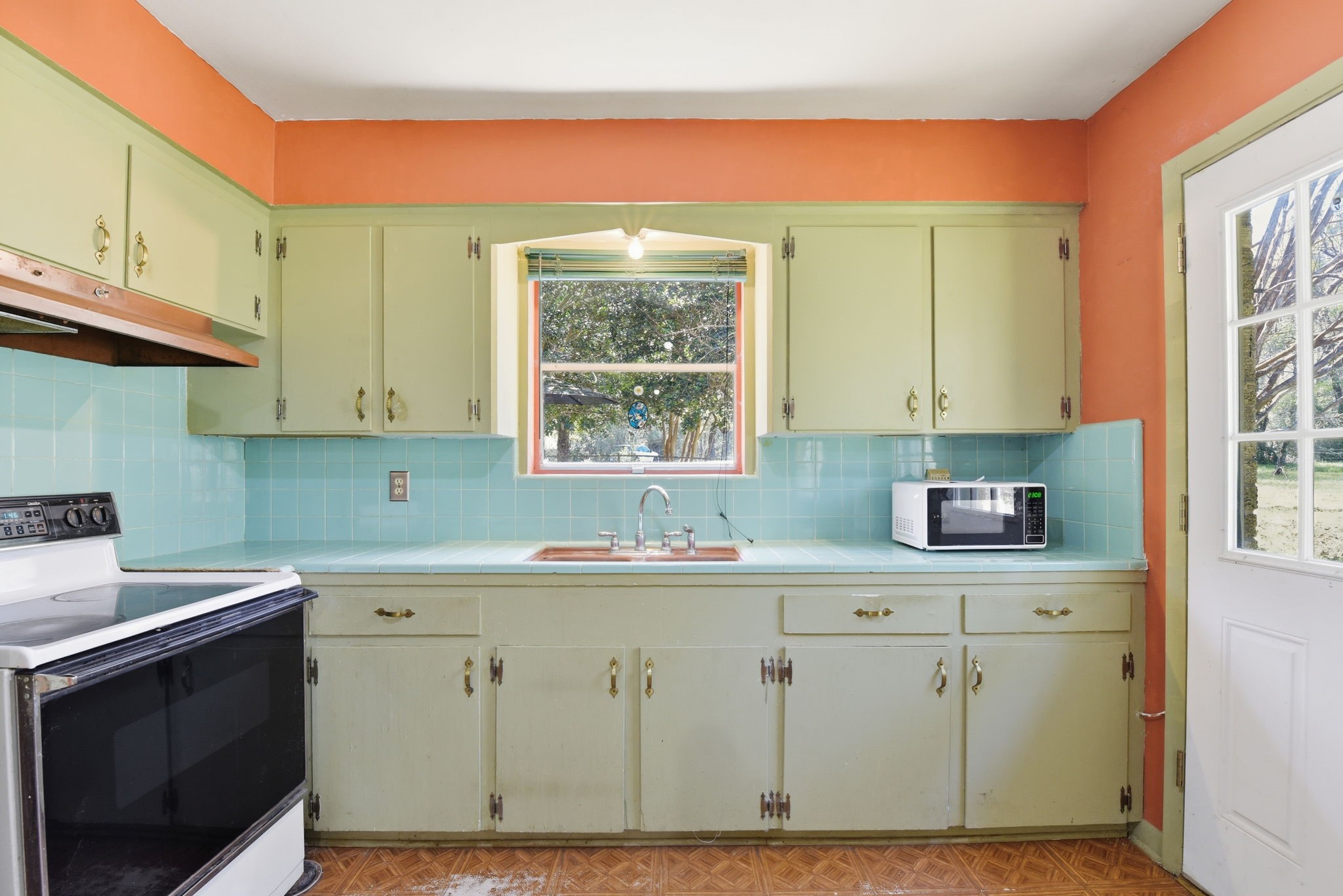 7555 Fm 1725 Road Coldspring, TX 77331 - Photo 7 of 31 a kitchen with a sink cabinets and a window