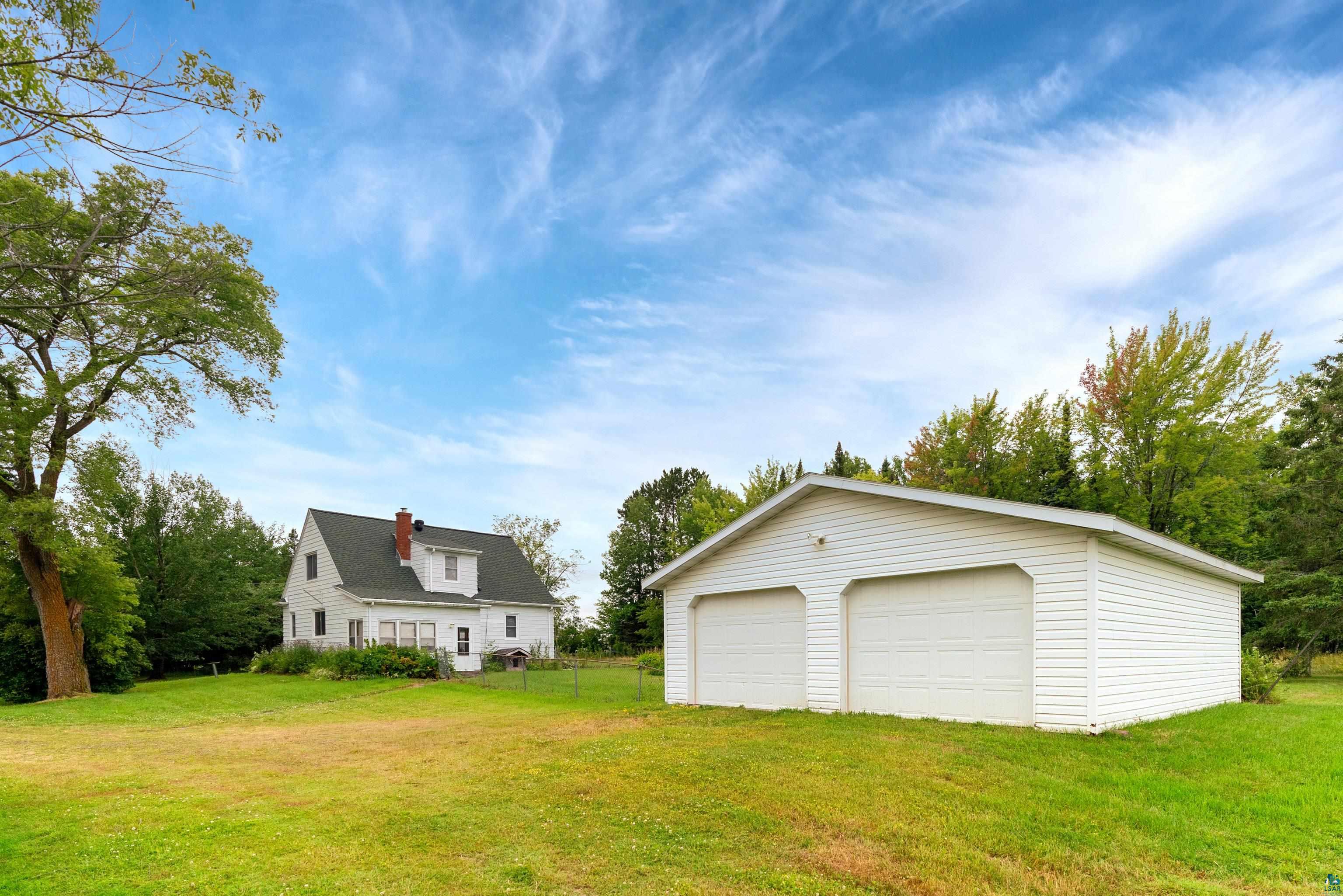 5988 Ryan Road Duluth, MN 55804 - Photo 39 of 50 View of yard featuring an outbuilding and a garage