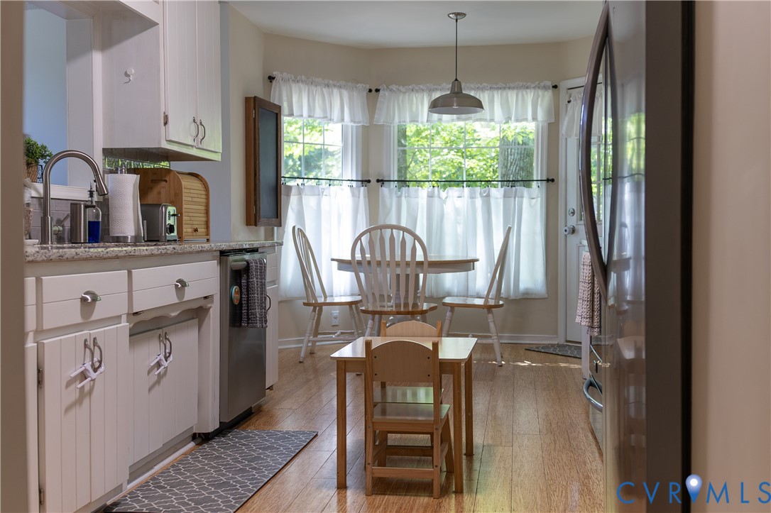 4924 Wilconna Road Chesterfield, VA 23832 - Photo 11 of 22 Kitchen featuring white cabinetry, granite-finish