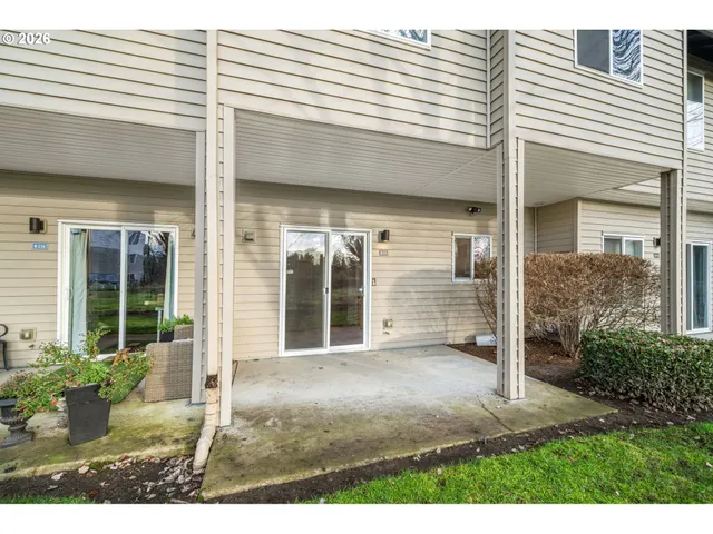 a view of a house with backyard and porch