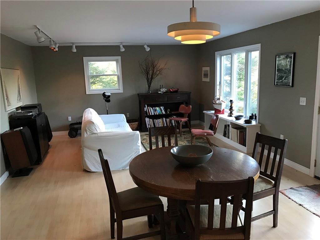 187 Shore Road Perry, ME 04667 - Photo 11 of 35 Living room with windows overlooking...