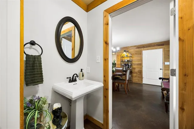 a bathroom with a double vanity sink toilet and shower