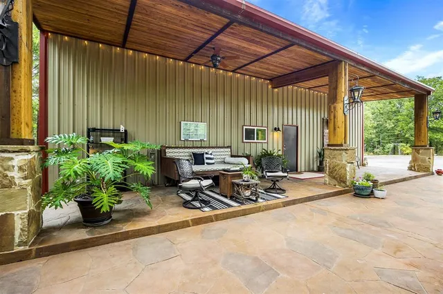 a building with potted plants in front of it