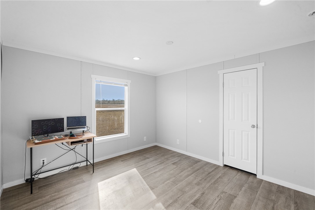 5236 County Road 219 Anderson, TX 77830 - Photo 13 of 35 a view of room with wooden floor lounge chair and windows