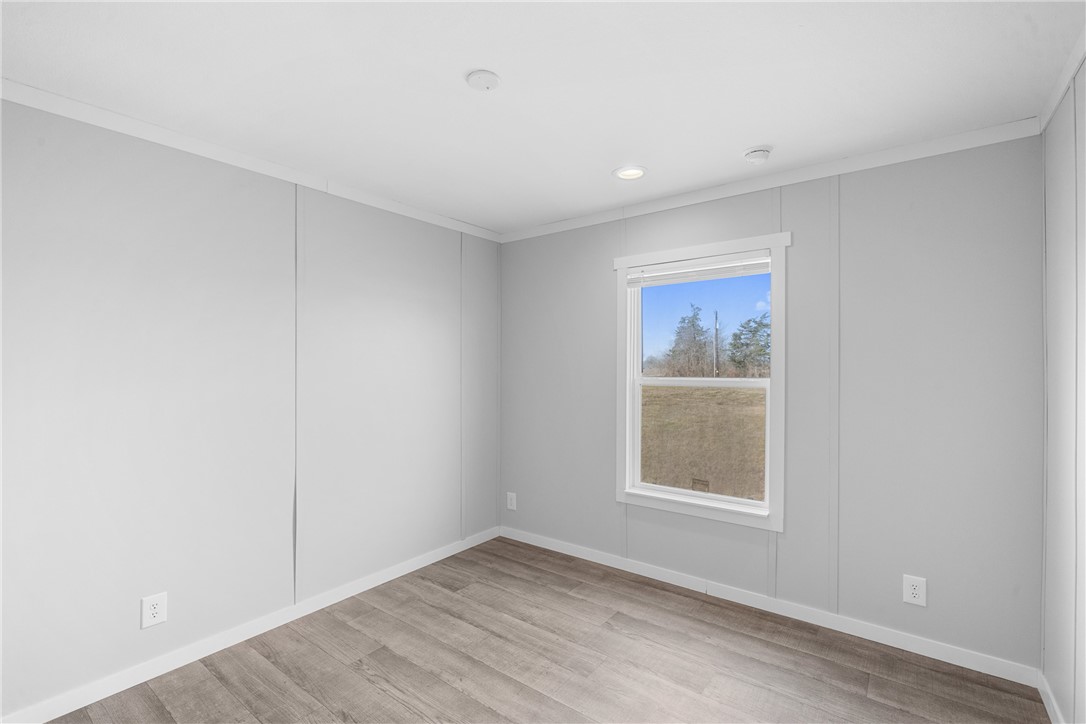 5236 County Road 219 Anderson, TX 77830 - Photo 20 of 35 a view of an empty room with wooden floor and a window
