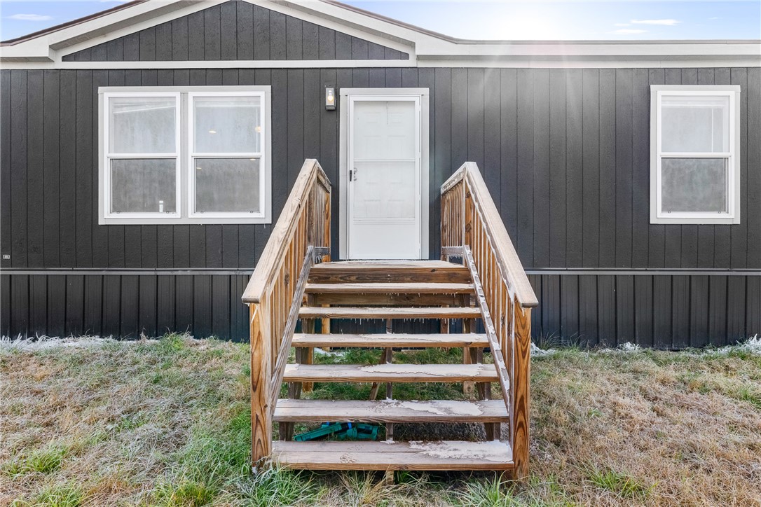 5236 County Road 219 Anderson, TX 77830 - Photo 6 of 35 a view of staircase with wooden floor and a chair
