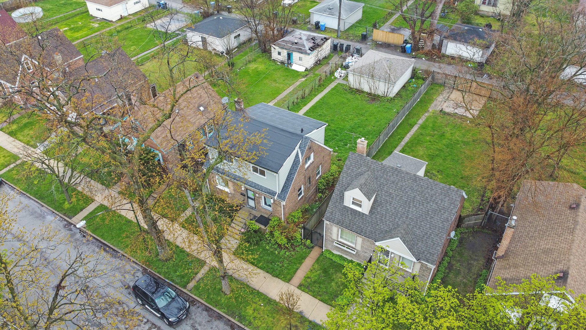 10233 South Calhoun Avenue Chicago, IL 60617 - Photo 3 of 22 an aerial view of a house with garden space and street view