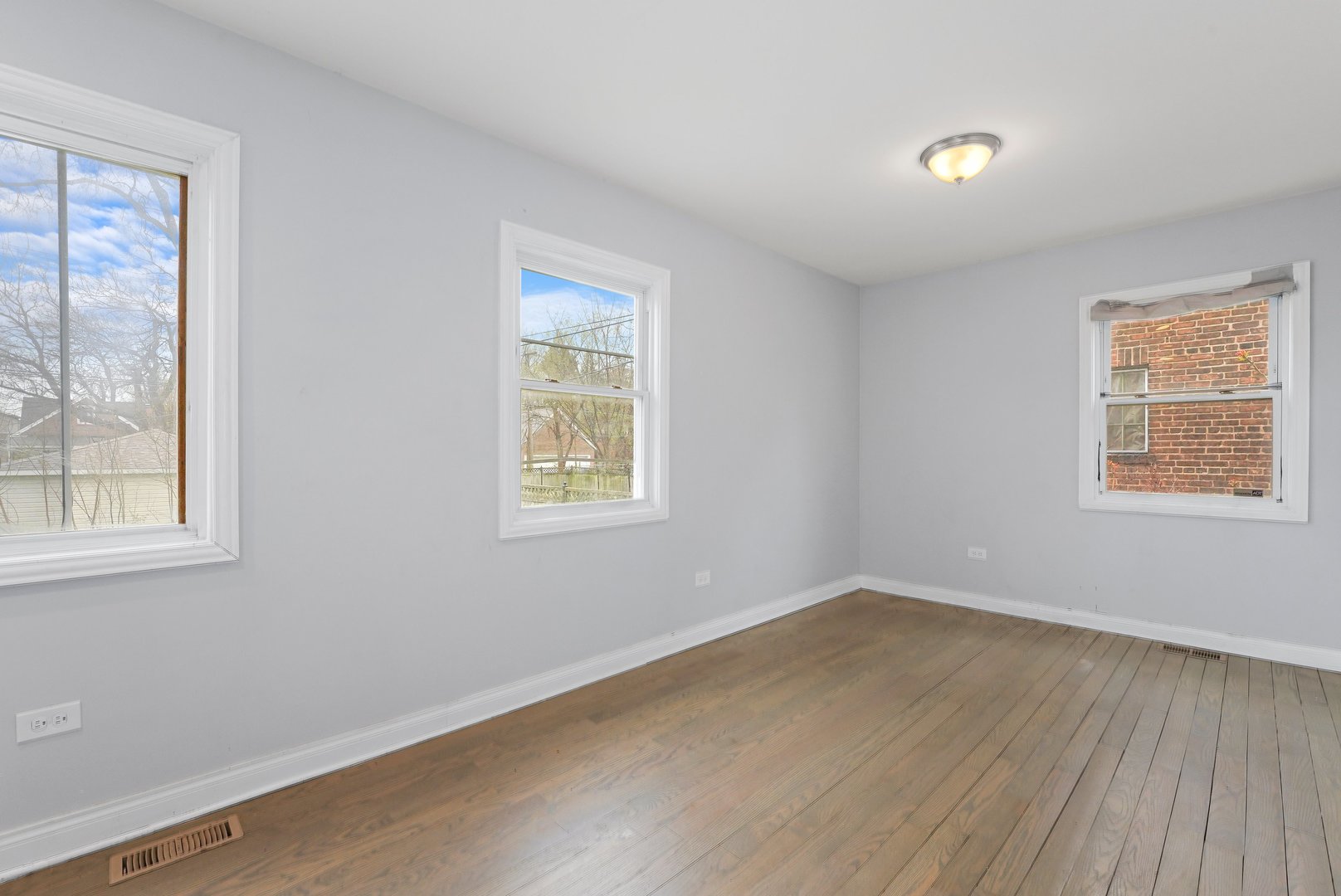 10233 South Calhoun Avenue Chicago, IL 60617 - Photo 9 of 22 an empty room with a window