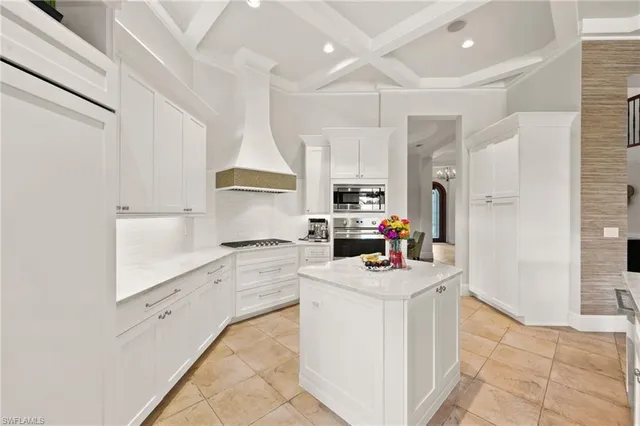 a view of a dining room with furniture water view and a floor to ceiling window