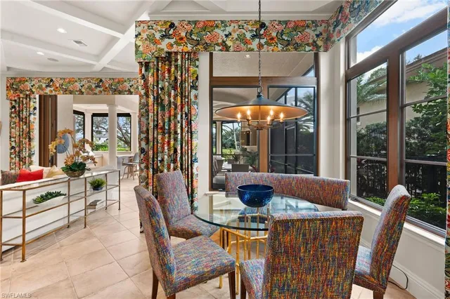 a bedroom with a large bed and a large window