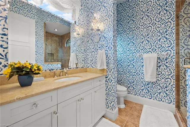 a bathroom with a sink a vanity and a mirror