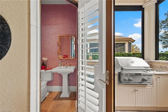 a view of kitchen with stove and refrigerator