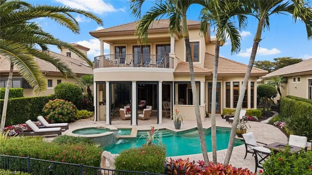 a view of a chairs and table in the balcony