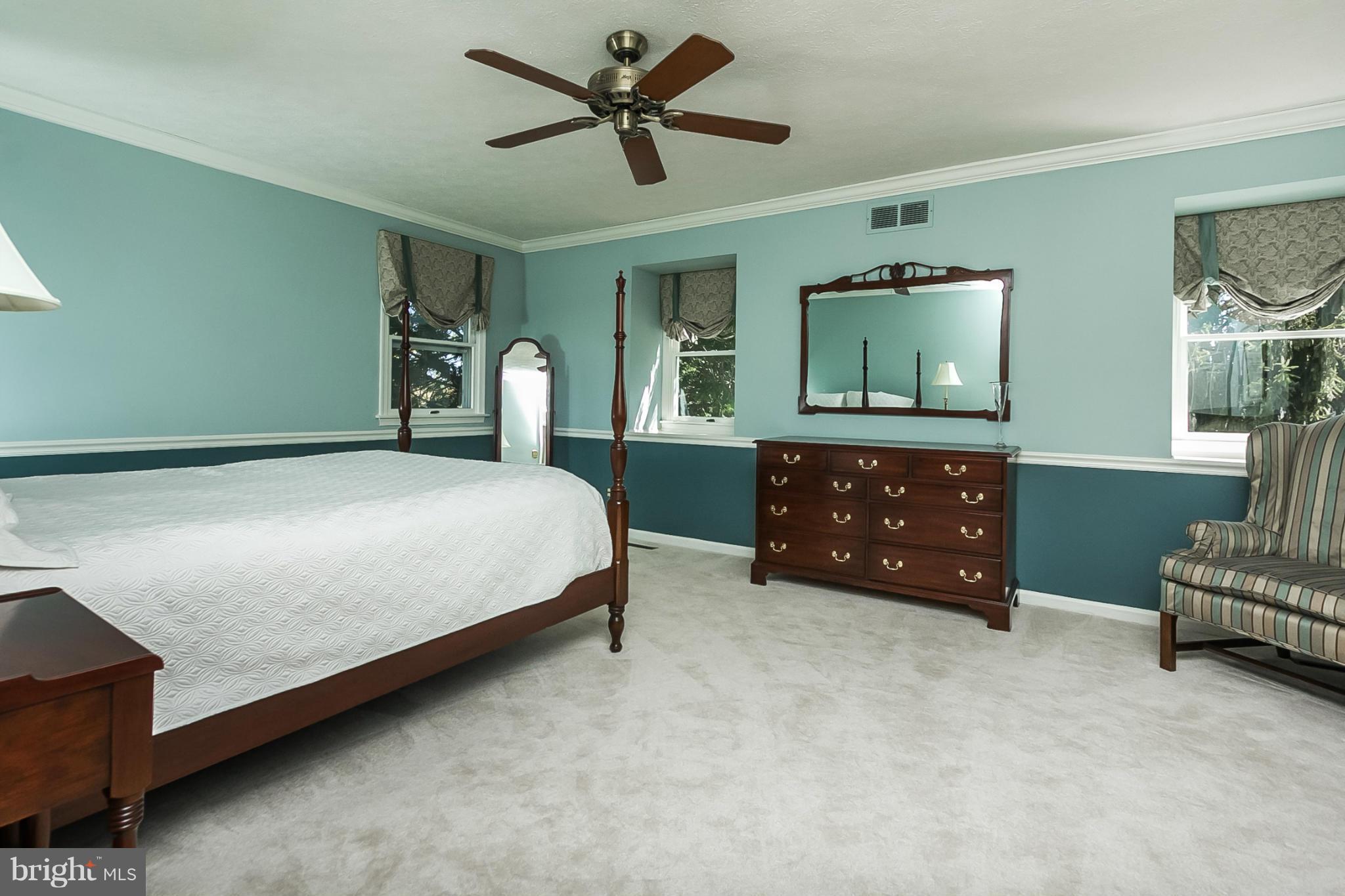 14106 Manor Road Phoenix, MD 21131 - Photo 14 of 30 a bedroom with a bed and a tv