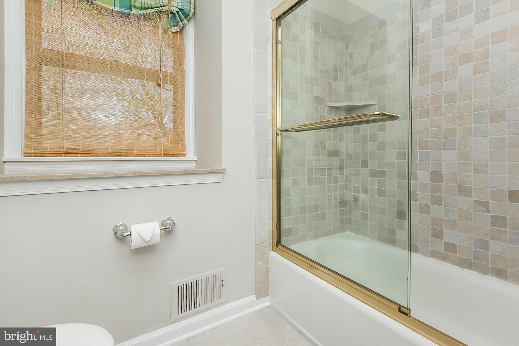 14106 Manor Road Phoenix, MD 21131 - Photo 23 of 30 a bathroom with a shower and bathtub