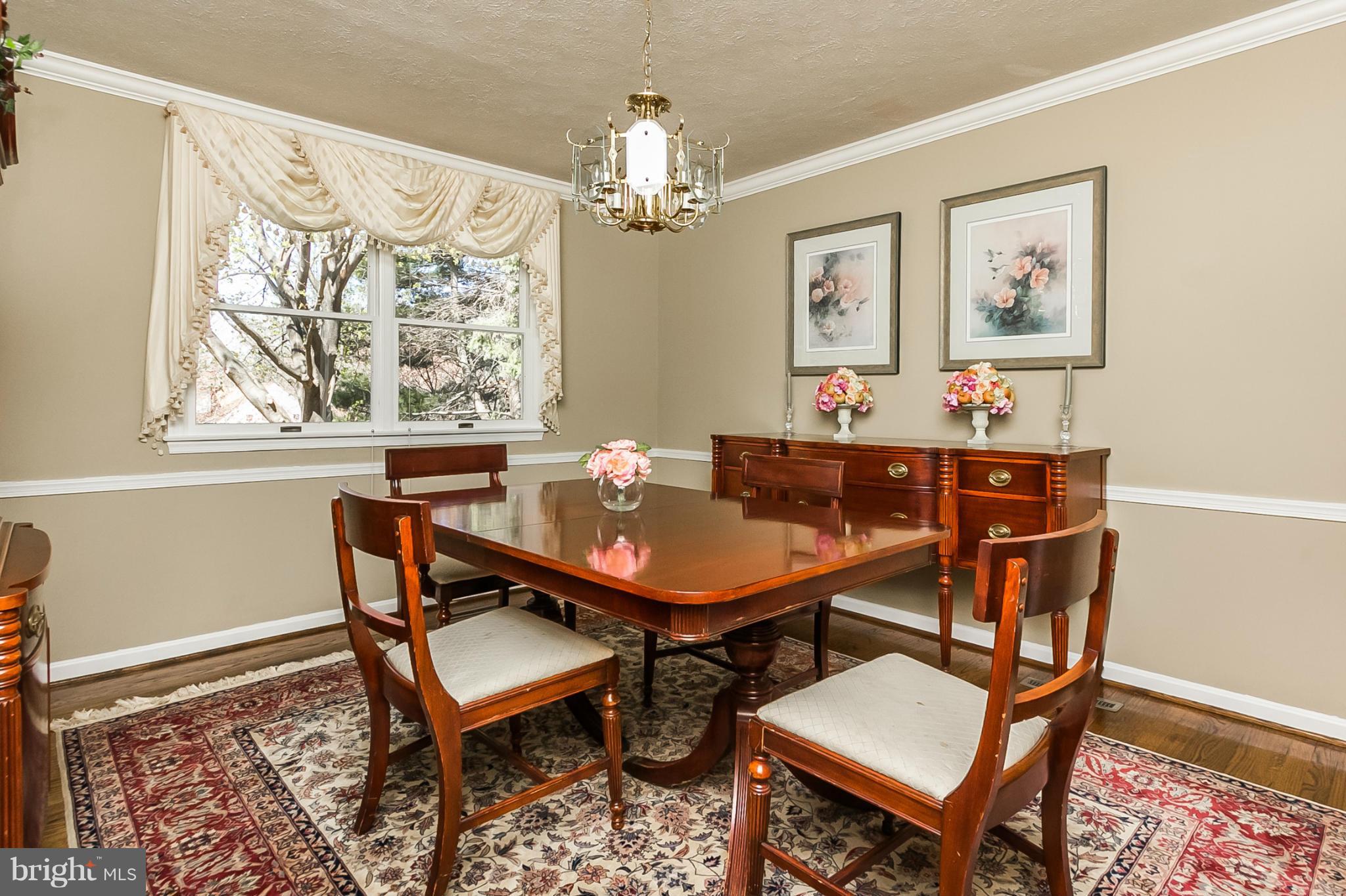 14106 Manor Road Phoenix, MD 21131 - Photo 6 of 30 a view of a dining room with furniture and chandelier