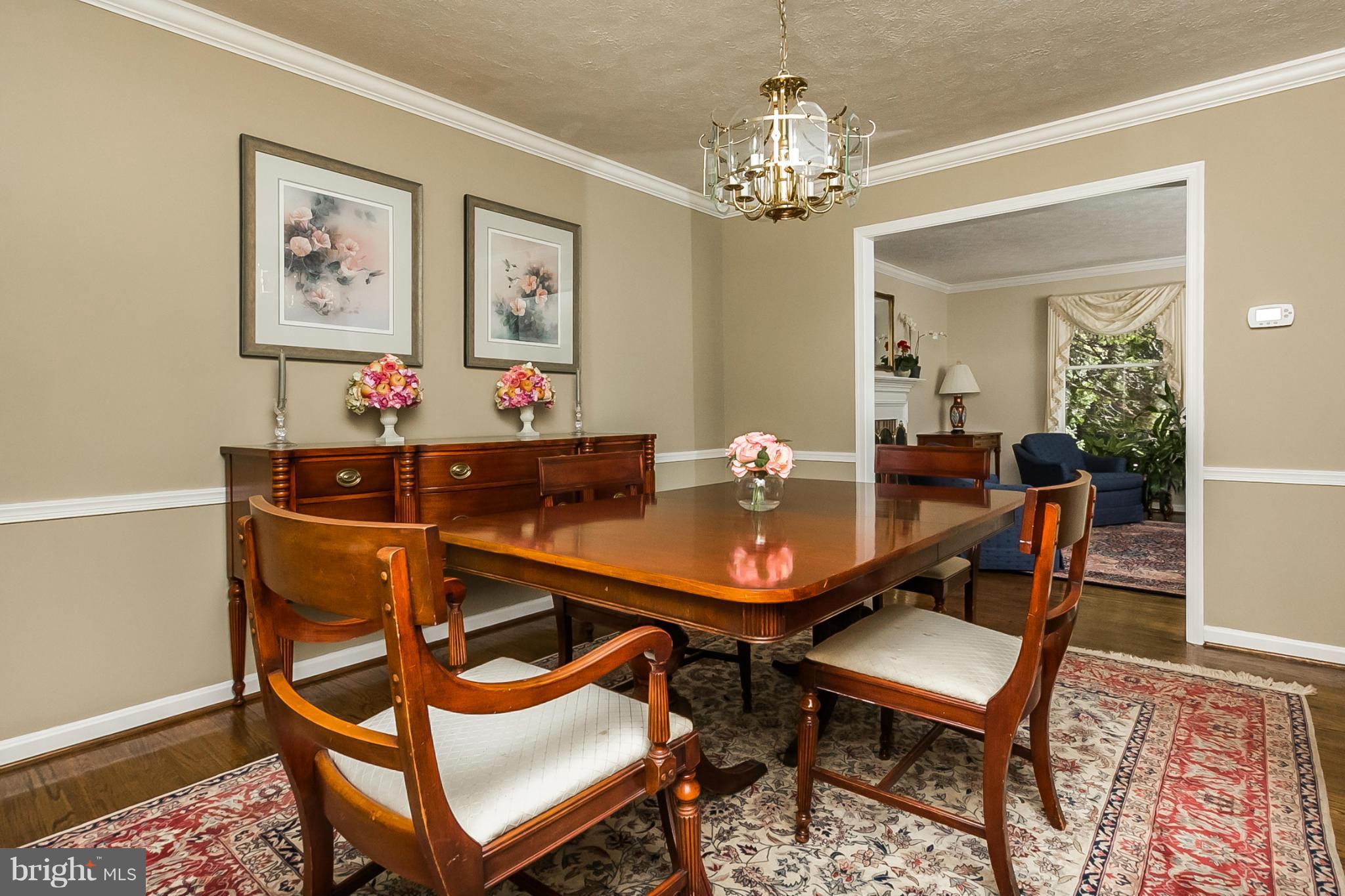 14106 Manor Road Phoenix, MD 21131 - Photo 7 of 30 a view of a dining room with furniture and chandelier