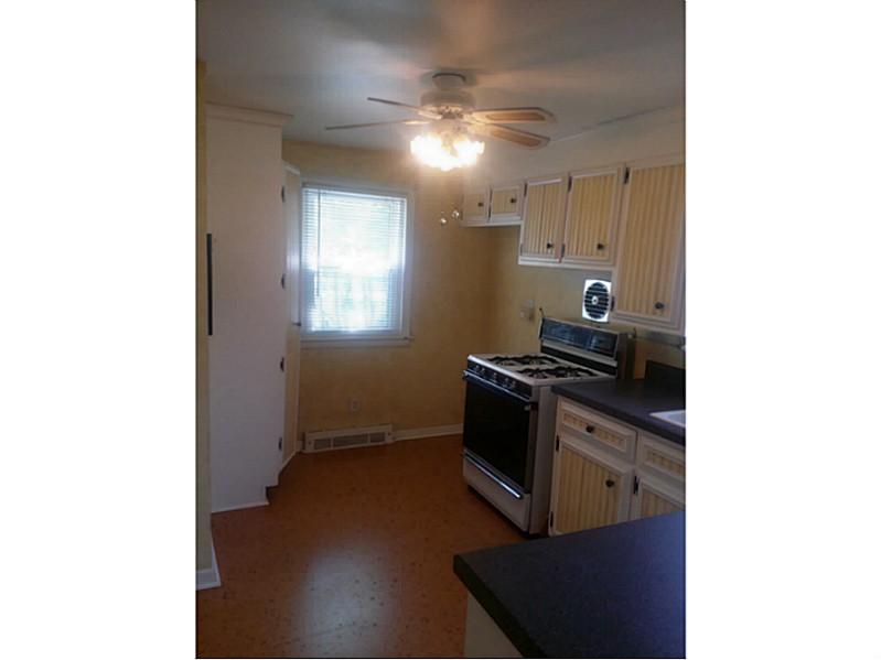 352 Old River Road Lincoln, RI 02838 - Photo 5 of 20 Kitchen. kitchen area with stove and storage