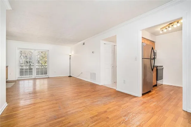 a kitchen with stainless steel appliances granite countertop a sink and a stove top oven