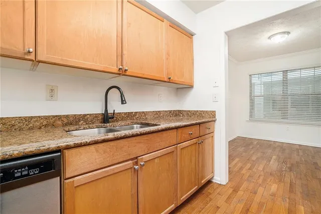 a bedroom with furniture and a chair