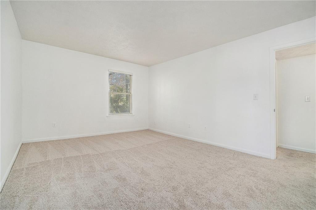 1150 Collier Road Northwest, Unit 12F Atlanta, GA 30318 - Photo 15 of 26 an empty room with windows