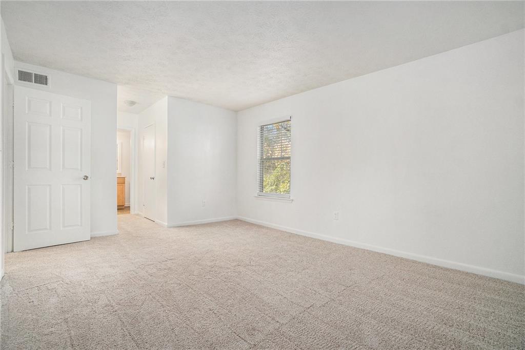 1150 Collier Road Northwest, Unit 12F Atlanta, GA 30318 - Photo 17 of 26 an empty room with windows