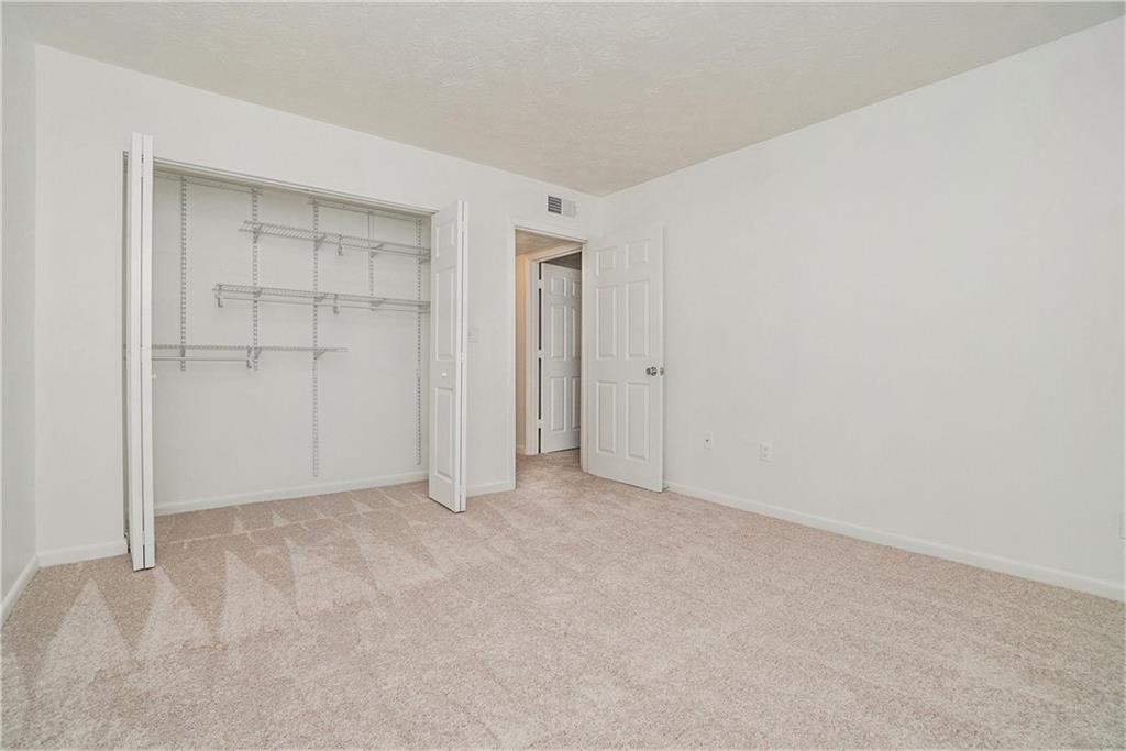1150 Collier Road Northwest, Unit 12F Atlanta, GA 30318 - Photo 21 of 26 a view of an empty room
