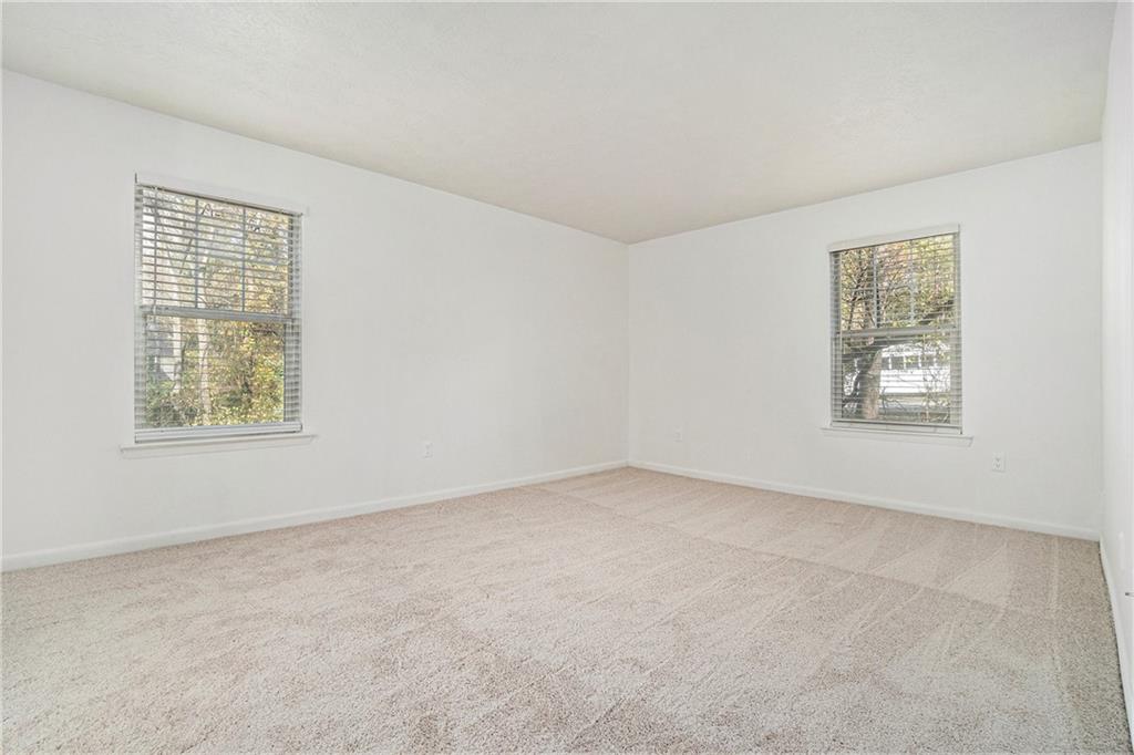 1150 Collier Road Northwest, Unit 12F Atlanta, GA 30318 - Photo 22 of 26 an empty room with windows