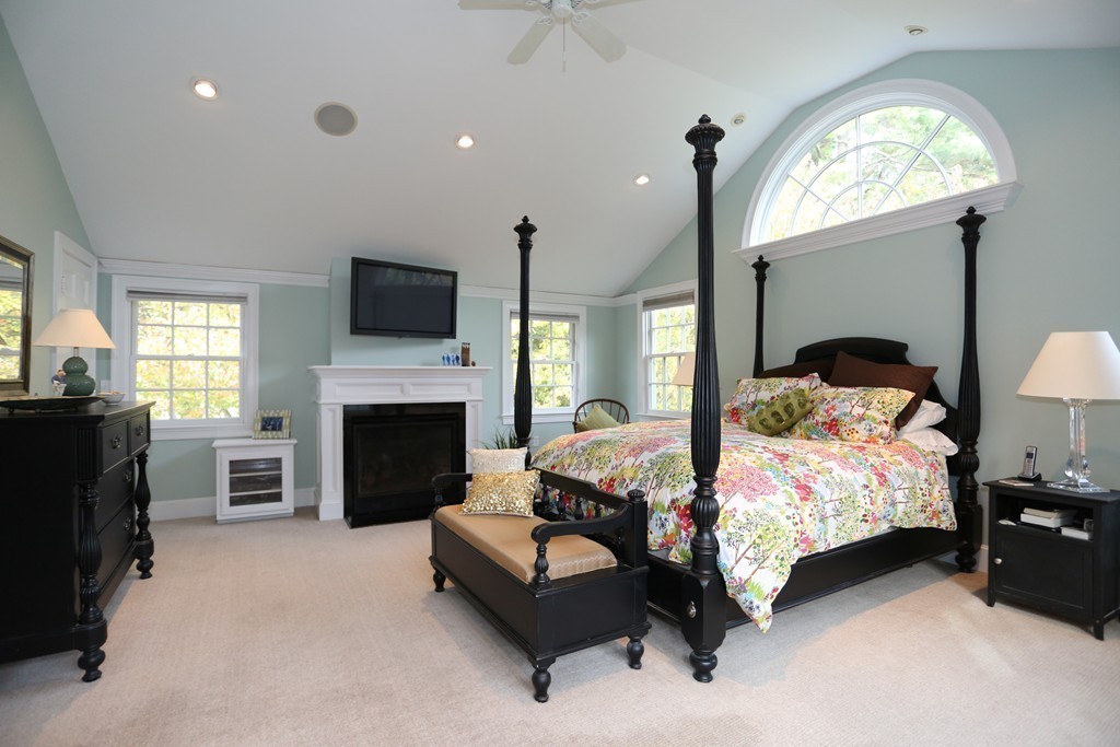 18 Winslow Road Wellesley, MA 02481 - Photo 14 of 19 a bedroom with a bed and a fireplace