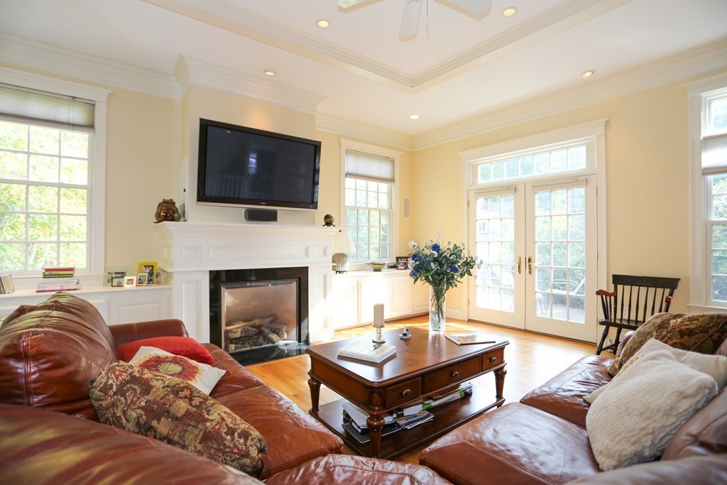 18 Winslow Road Wellesley, MA 02481 - Photo 7 of 19 a living room with furniture a flat screen tv and a fireplace
