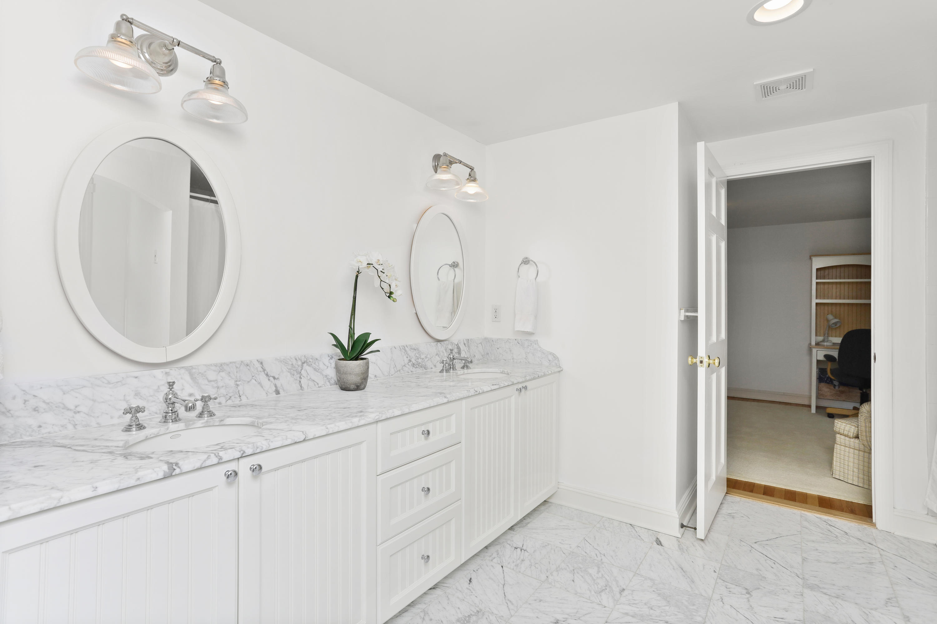 298 Brookside Road Darien, CT 06820 - Photo 22 of 36 a bathroom with a double vanity sink and a mirror
