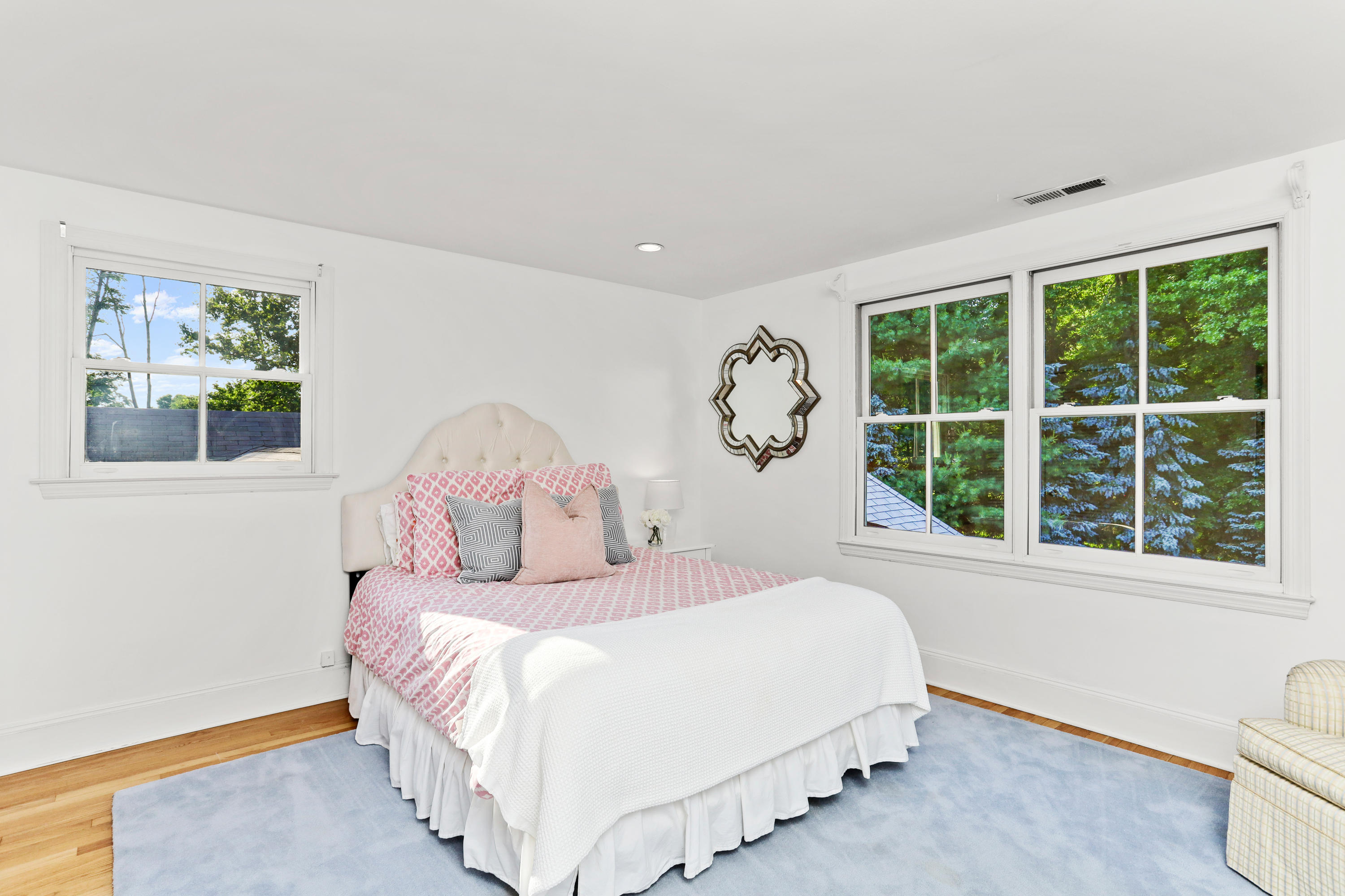 298 Brookside Road Darien, CT 06820 - Photo 24 of 36 a bedroom with a large bed and a window