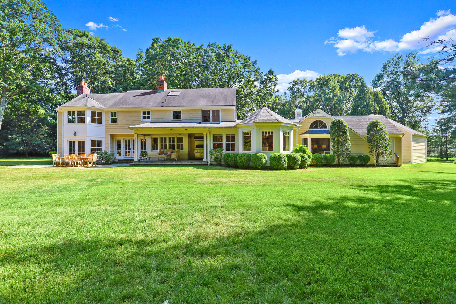 298 Brookside Road Darien, CT 06820 - Photo 30 of 36 a view of a house with a big yard